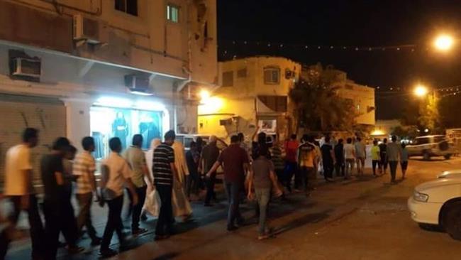 Bahraini protesters march along a street during an anti-regime demonstration in the island of Sitrah, Bahrain, August 16, 2016.