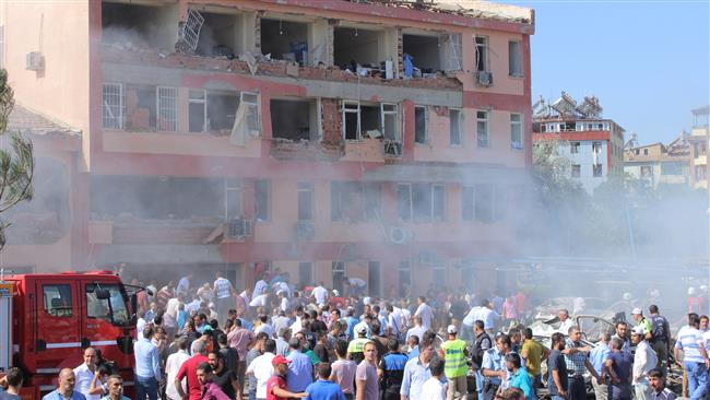 People rush to the blast scene after a car bomb attack on a police station in Elazig, Turkey, August 18, 2016.