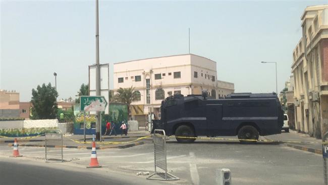 A Bahraini military vehicle blocks the road leading to Diraz to bar people from congregating at a mosque for prayers, August 20, 2016