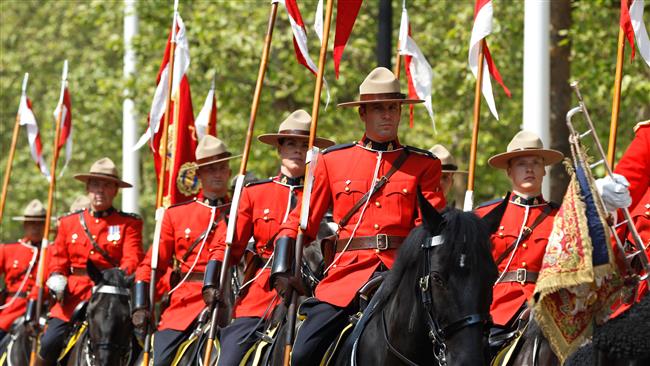 members of the Royal Canadian Mounted Police wearing the iconic uniform of the force which dates back to the 1800s.