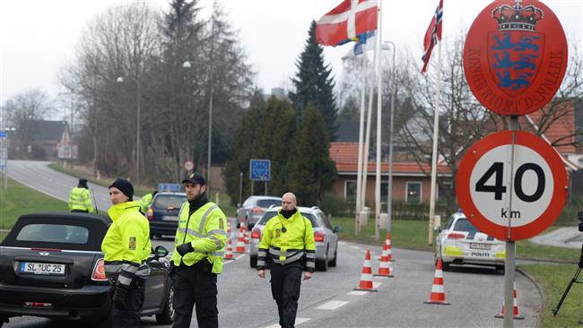 The file photo shows Danish police patrolling the Danish-German border crossing.
