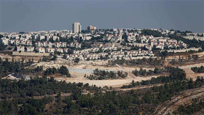 The picture taken on July 29, 2016 shows a general view of Israeli construction cranes and excavators at the building site of new settler units in the illegal settlement of Gilo in East Jerusalem al-Quds. ©AFP
