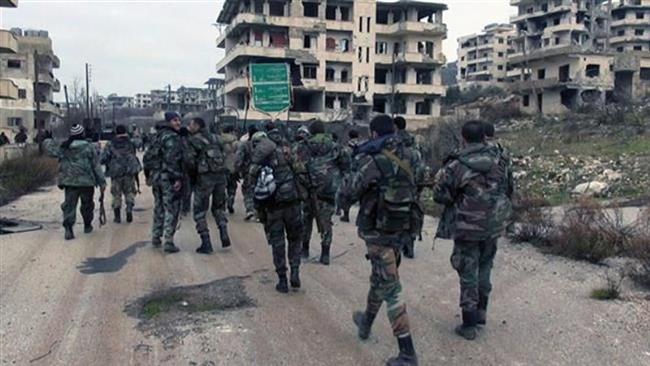 The file photo shows Syrian troops on the outskirts of the northwestern city of Aleppo. (Photo by SANA)