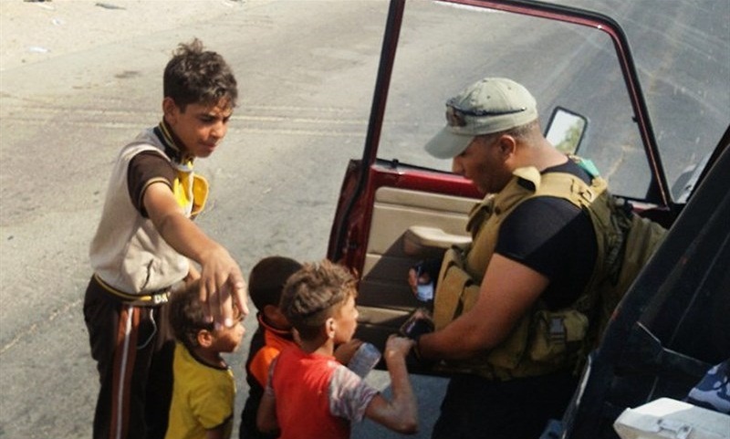 Iraqi Voluntary Forces Save Stranded Civilians on Road to Tikrit
