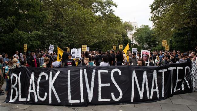 Black Lives Matter protesters rally during a protest against police brutality at City Hall Park, August 1, 2016 in New York City.
