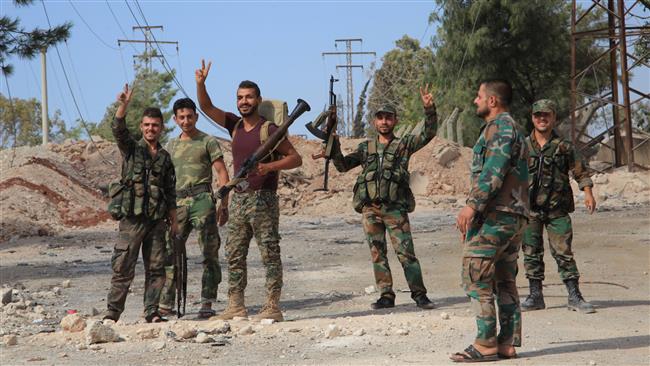 Syrian soldiers gesture at a location on the southern outskirts of the northwestern Syrian city of Aleppo, September 4, 2016. (Photo by AFP)