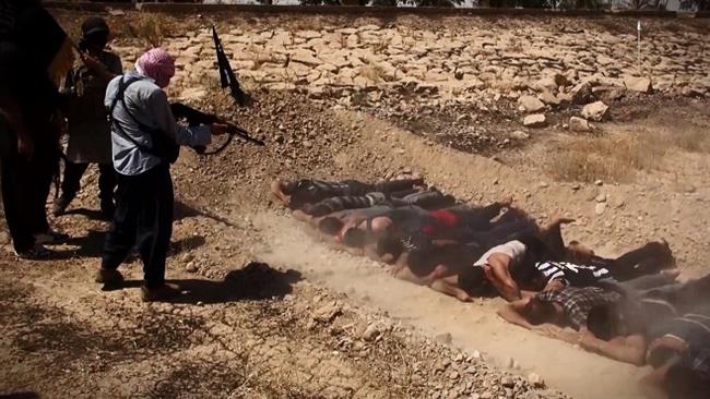 An image taken from a video posted by Daesh militants shows the terrorists executing captured Iraqi soldiers from Camp Speicher near Tikrit, northern Iraq, on June 12, 2014. 