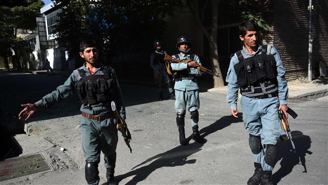 Afghan security personnel patrol near the site of an ongoing attack on a charity in central at the Shar-e-Naw in Kabul, September 6, 2016. (Photo by AFP)