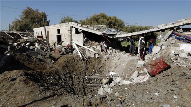 Yemenis stand near a crater on the ground following an airstrike by Saudi warplanes in the Yemeni capital, Sana’a, September 4, 2016. (Photo by AFP)
