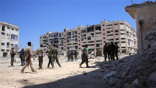 Syrian army soldiers patrol the area around the entrance of Aleppo’s Bani Zeid district on July 28, 2016. (AFP)
