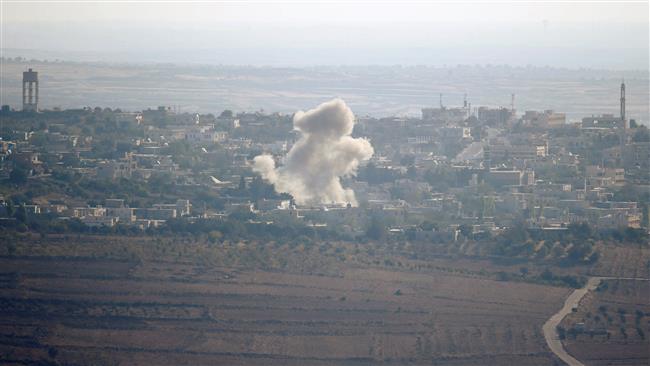 A picture taken from the Israeli-held Golan Heights on September 10, 2016 shows smoke rising from the Syrian village of Jubata al-Khashab. ©Reuters
