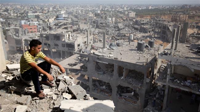 The photo shows a Palestinian man looking out over destruction caused by Israel’s 2014 war in Gaza City