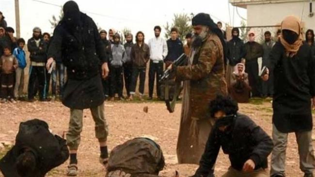 The undated photo shows Takfiri terrorists executing a group of people in an unspecified location.
