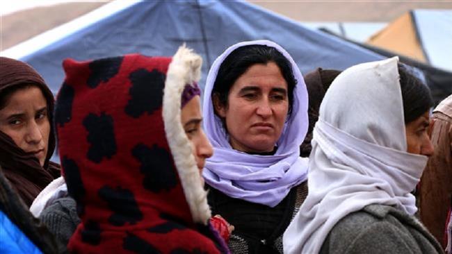 This photo taken on January 15, 2015 shows displaced Iraqi women from the Izadi community, who fled the Daesh terrorist group in the northern Iraqi town of Sinjar. (Photo by AFP)