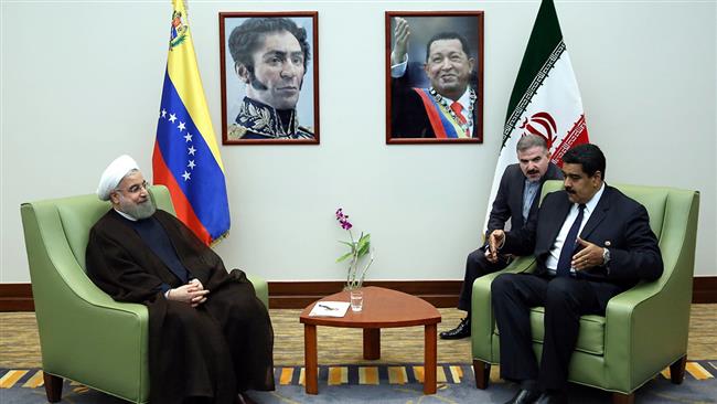 Iranian President Hassan Rouhani (L) and his Venezuelan counterpart Nicolas Maduro meet in Margarita Island, Venezuela, on September 16, 2016