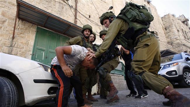 Israeli soldiers try to arrest a Palestinian man in the city of Hebron (al-Khalil), in the occupied West Bank, on September 20, 2016. (Photo by AFP)