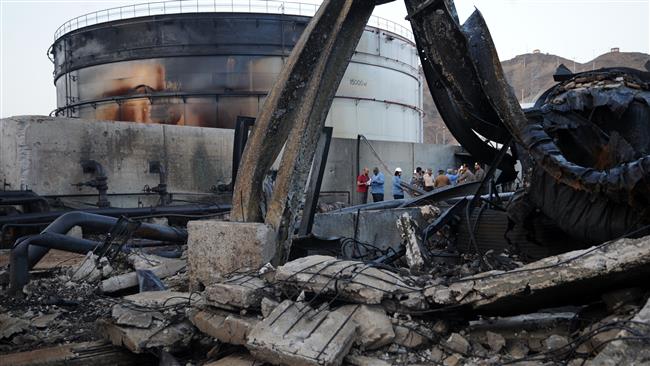 A group of Saudi officials, workers and journalists inspect the damage at a power station on August 27, 2016 in the Saudi border city of Najran, a day after it was struck by a rocket fired from Yemen. (Photo by AFP)
