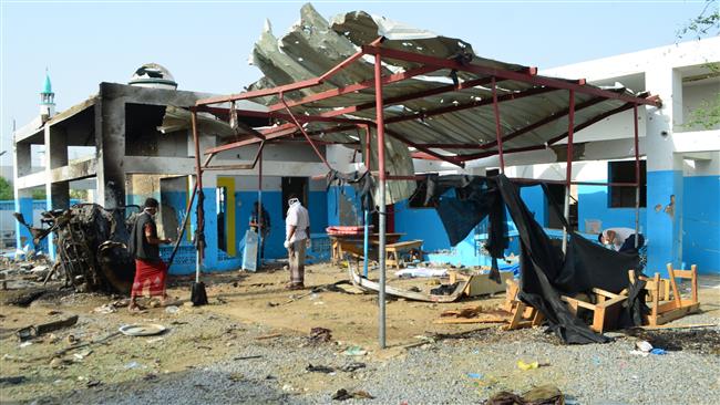 Yemeni workers clean an MSF hospital in the Abs district of Hajjah province, one day after it was hit by a Saudi airstrike on August 15, 2016. (Photo by AFP)
