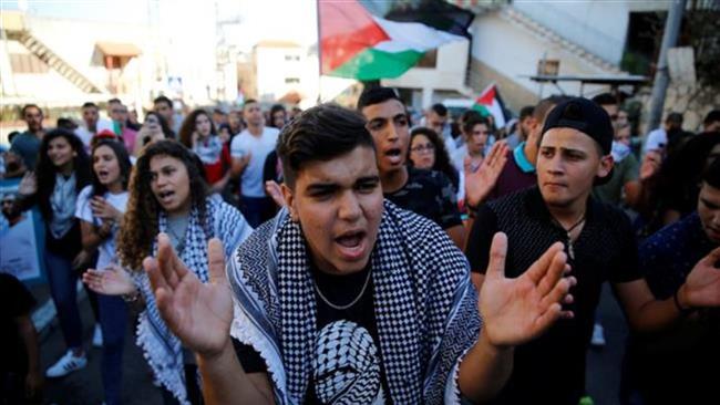 Palestinians living in the occupied territories march in Sakhnin on October 1, 2016 to mark the 16th anniversary of the Second Palestinian Intifada. (Photo by Reuters)
