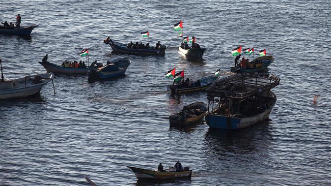 Palestinians sail boats in the port of Gaza City in support of the Gaza-bound flotilla of international female activists attempting to break the Israeli blockade on October 5, 2016. (Photo by AFP)
