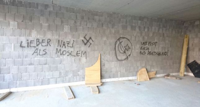 Suspects scrawled anti-Islamic slogans on the mosque’s walls and drew a swastika.
