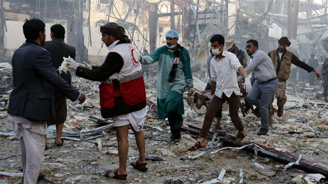 Medics carry the body of a victim of a Saudi airstrike in Sana’a, Yemen, October 8, 2016. (Photo by AP)
