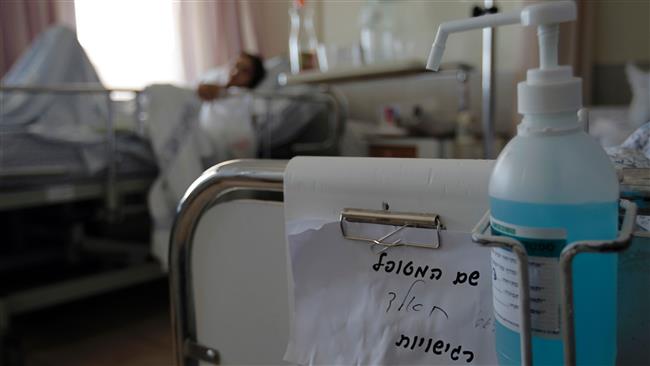 A militant injured during the Syrian war lies on a bed at Ziv Hospital in the northern Israeli town of Safed on March 10, 2016. (photo by AFP)                
