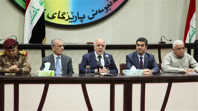 Iraqi Prime Minister Haider al-Abadi (C) speaks next to Kirkuk Provincial Governor Najm al-Din Karim (2nd, L) and the head of the Kirkuk Provincial Council, Rebwar Talabani (2nd, R), during a meeting in the northern Iraqi city of Kirkuk on October 14, 2016. (Photo by AFP)
