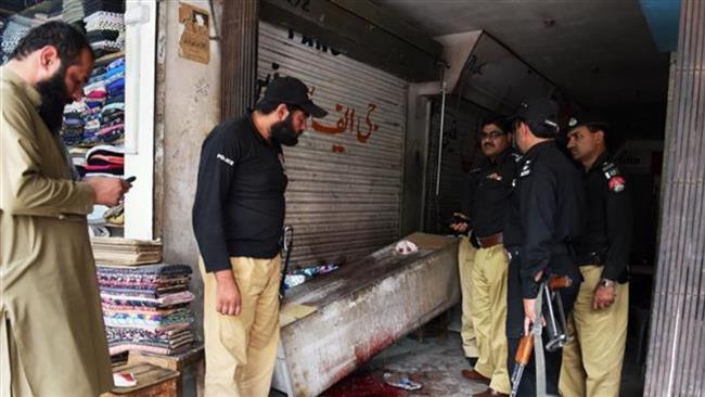 Pakistani police are seen at the site of a shooting attack against the Hazara Shia community in a market in southwestern city of Quetta, May 27, 2015. (Photo by AFP)
