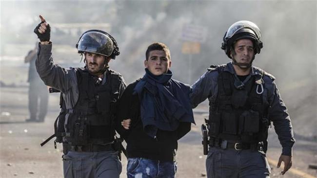 Israeli soldiers arrest a Palestinian boy in the West Bank.
