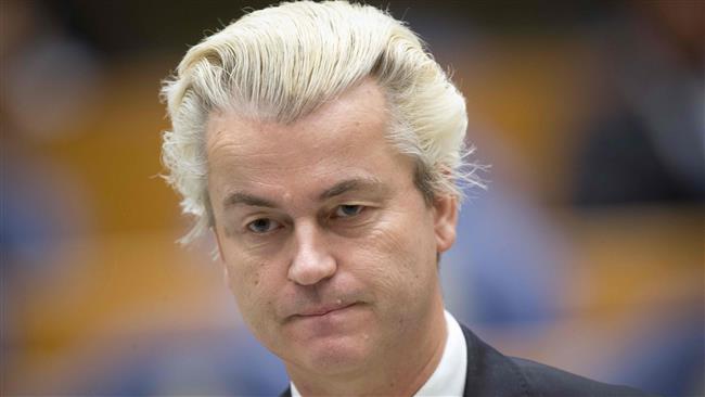 This file photo, taken on December 18, 2014, shows Dutch far-right politician Geert Wilders standing at the Parliament building in The Hague. (By AFP)
