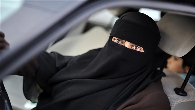 The file photo shows a Saudi woman behind the wheel despite a ban in the kingdom on women