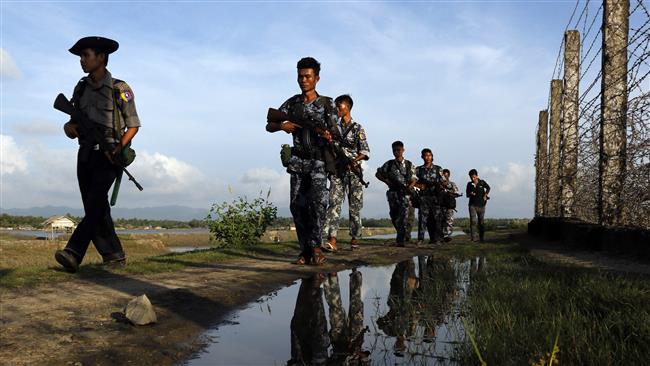 Myanmar police officers patrol along the border with Bangladesh in Maungdaw, Rakhine State, Myanmar, October 14, 2016. (Photo by AP)
