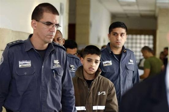 File photo shows teenage Palestinian prisoner Ahmad Saleh Manasra (C)
