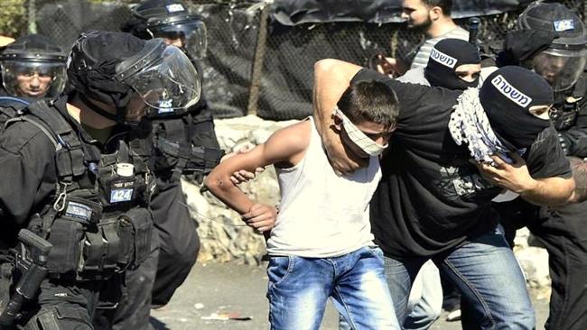 In this file photo, Israeli forces, including soldiers disguised as Palestinians, violently arrest a Palestinian child in the occupied Jerusalem al-Quds.