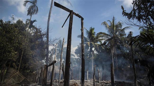 This photo, taken in Warpait Village, a Muslim village in Maungdaw, Myanmar, on October 14, 2016, shows the smoldering debris of a house burned down by suspected army soldiers. (By AFP)