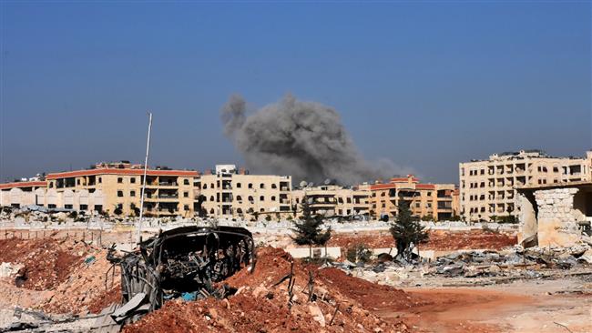 Smoke billows after rockets fired by militants exploded in an area near Aleppo