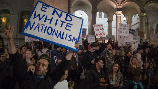 People protest the appointment of white nationalist media mogul Steve Bannon to be chief strategist of the White House by President-elect Donald Trump on November 15, near City Hall in Los Angeles, California. (Photo by AFP)