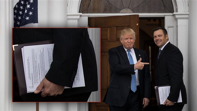 President-elect Donald Trump and Kris Kobach, Kansas secretary of state, pose for a photo following their meeting with president-elect at Trump International Golf Club, November 20, 2016 in Bedminster Township, New Jersey. 