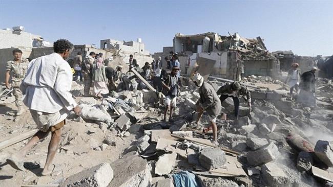 People search for survivors under the rubble of houses destroyed by a Saudi airstrike near Sana