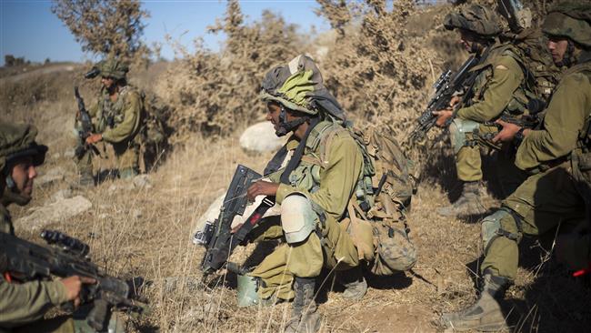 Israeli troops take position during training in the occupied Golan Heights, September 13, 2016.