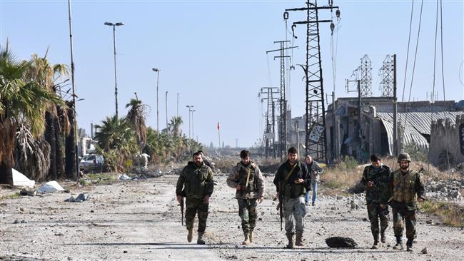 Syrian pro-government forces advance in Aleppo’s eastern district of Maysar as part of an ongoing operation to recapture all of the battered city on December 4, 2016. (Photo by AFP)
