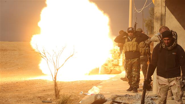 Iraqi forces backed by tribal fighters fire artillery during battle to retake a village from Daesh on the eastern bank of the Tigris River on December 7, 2016. (Photos by Reuters)