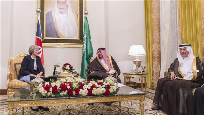 A handout picture provided by the Saudi Royal Palace on December 6, 2016 shows Saudi King Salman (C) meeting with British Prime Minister Theresa May (L) on December 6, 2016, in the Bahraini capital Manama.