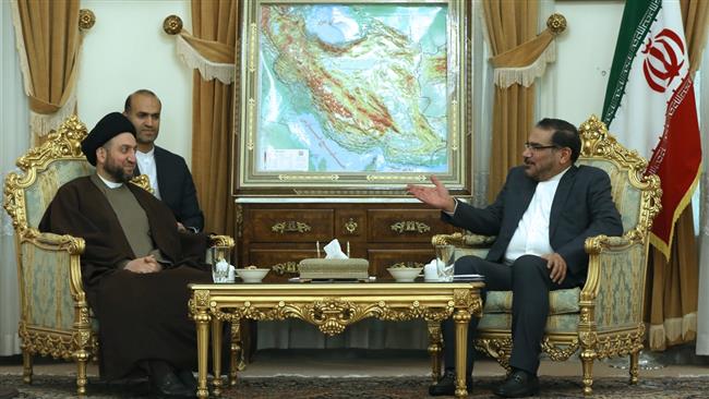 Secretary of Iran’s Supreme National Security Council Ali Shamkhani (R) and Head of the Iraqi National Alliance Ammar al-Hakim meet in Tehran on December 12, 2016.