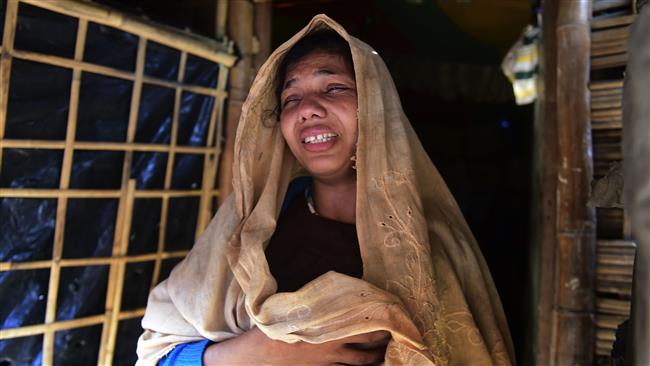 Myanmarese Rohingya migrant Nur Begum reacts after the death of her six-year-old son in a refugee camp in Teknaf, in Bangladesh, November 26, 2016. (Photo by AFP)
