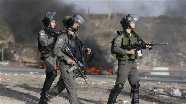 The file photo shows Israeli forces during clashes with Palestinians in the occupied West Bank. (Photo by AFP)
