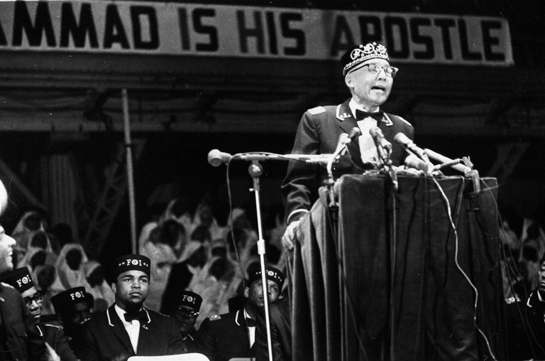 The heavyweight champion Muhammad Ali, left, as the Nation of Islam leader Elijah Muhammad spoke in Chicago in 1967. 