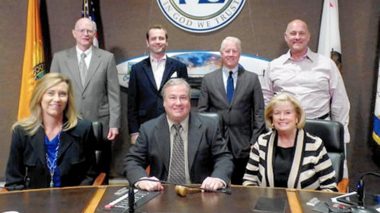 Michael Hoskinson, rear right, is pictured with the rest of the Huntington Beach Planning Commission in this undated photo. Hoskinson has resigned amid controversy over comments he made online about Islam and “leftists.”