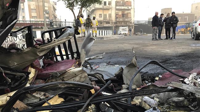 Iraqis inspect the aftermath of a car bomb in Baghdad, Iraq, on December 4, 2016. (Photo by AP)
